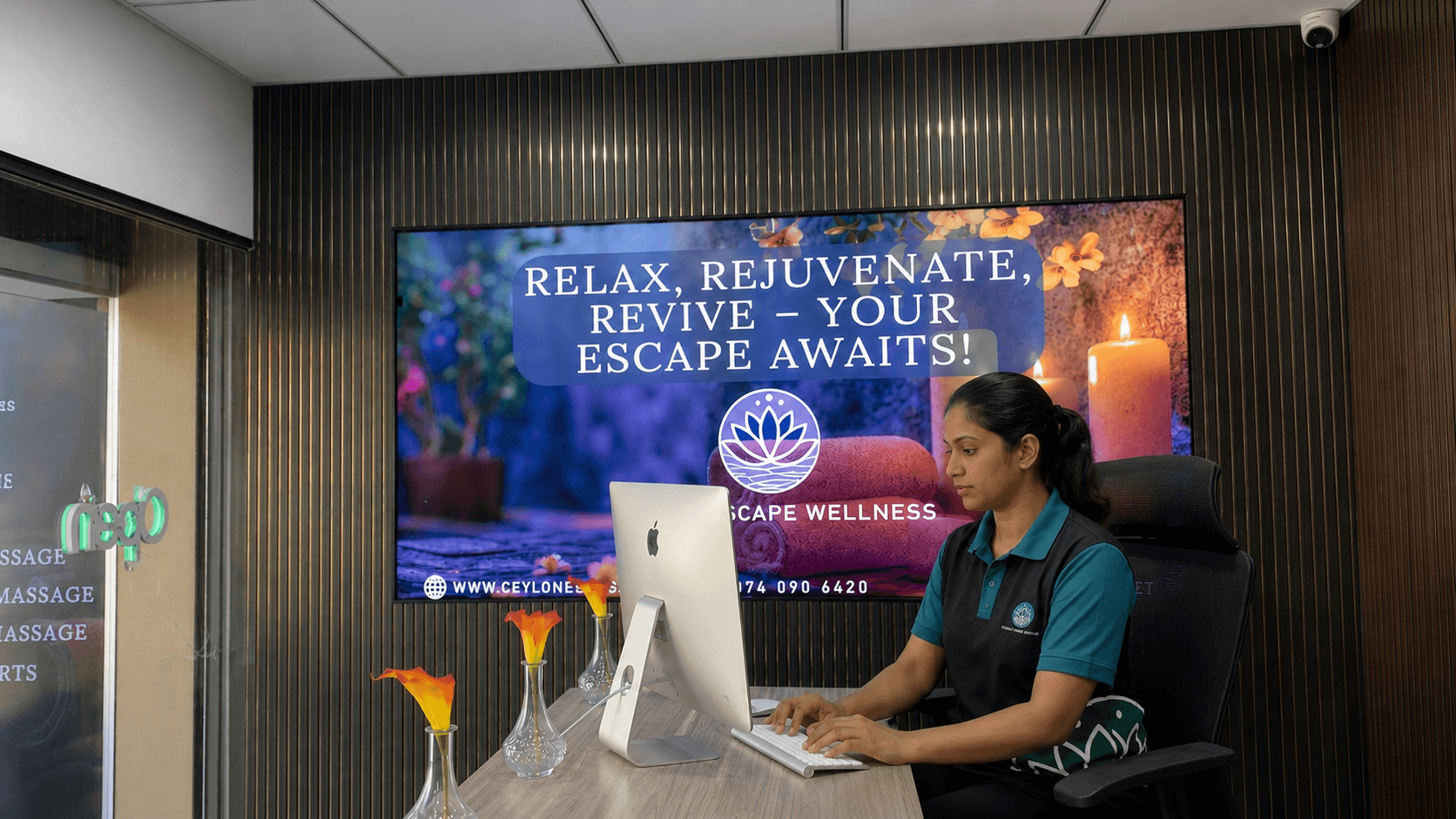 Our receptionist welcoming guests at the front desk